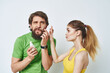 © SHOTPRIME STUDIO - bearded man next to woman shaving facial in bathroom