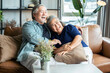 old senior asian retired age marry ciuple wellness lifesstyle together at home,old people laugh smile together with love and bonding on sofa in living room home interior background