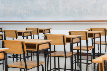 Wall Mural - school empty classroom with test sheet or exams paper on desks chair wood at high school thailand, e