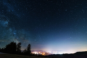 Wall Mural - bright starry sky with the milky way on the background of high tatras mountains