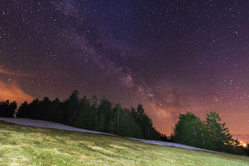 Wall Mural - bright starry sky with the milky way on the background of high tatras mountains