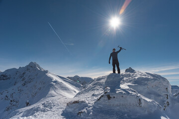 Wall Mural - Beautiful winter views of the High Tatra Mountains with tourists, skiers and amazing states of nature	