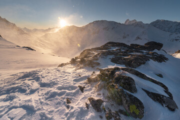 Wall Mural - beautiful winter views of the high tatra mountains with tourists, skiers and amazing states of natur