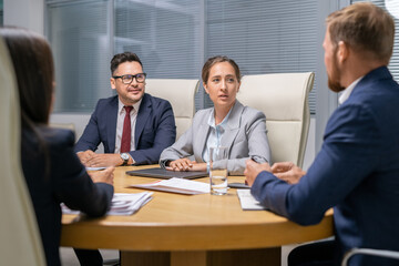 Aufkleber - Group of young colleagues discussing working points at meeting in boardroom