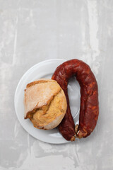 Wall Mural - typical portuguese smoked sausage chourico with olives and bread