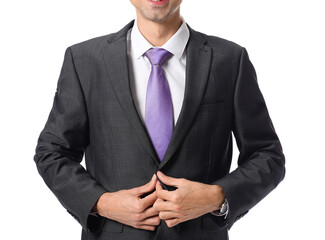 Wall Mural - Young man in stylish suit on white background