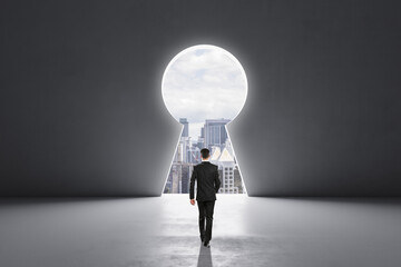 Poster - Back view of businessman walking in concrete interior with abstract keyhole window with city view. Key to success and career growth concept. Mock up place.