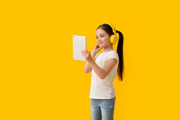 Sticker - Little girl with tablet computer listening to audiobook on color background