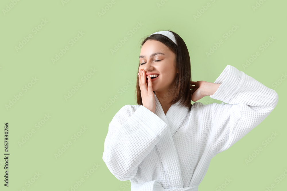 Sleepy young woman on color background