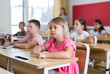 © JackF - Portrait of tired schoolgirl sitting in classroom during lesson in elementary school