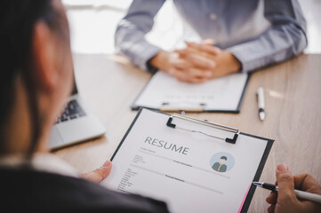 Wall Mural - Human resource manager Is explaining the job to the job seeker before filling out a resume on the application form to consider accepting for employment in the company..