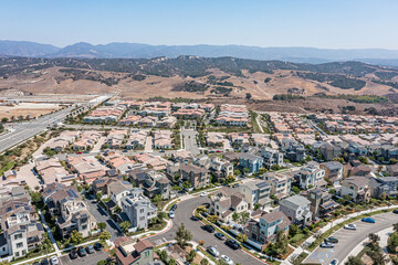 Wall Mural - Aerial view of a modern upscale suburban neighborhood with single family homes on a clear day