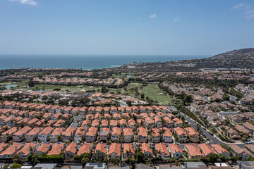 Wall Mural - Aerial View of an upscale California oceanfront neighborhood, aerial view of golf course, ocean, and master planned community