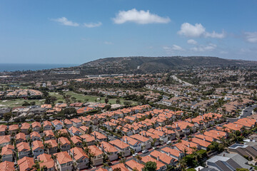 Wall Mural - Aerial View of an upscale California oceanfront neighborhood, aerial view of golf course, ocean, and master planned community