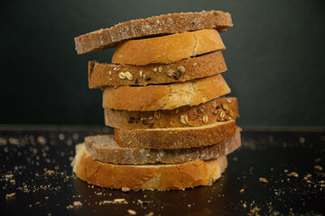 Poster - Stack of sliced loaves of bread on a table