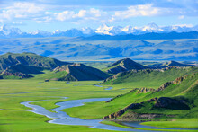 Bayinbuluke Grassland Natural Scenery In Xinjiang,China.Beautiful Grassland And Mountain Landscape.