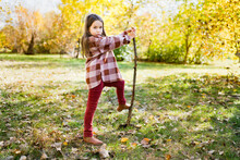 Children Hiking In The Forest. Girls Walking And Exploring Nature In The Woods On Sunny Autumn Day And Playing With Stick. Outdoor Recreation And Family Awesome Adventures With Kids In Fall