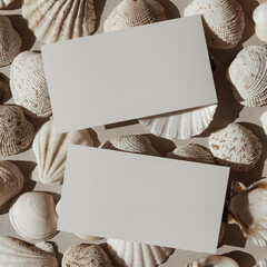 Wall Mural - Neutral beige and white seashells pattern background. Blank paper card sheet with empty mock up copy space. Aesthetic minimalist blog, social media template