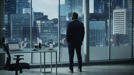 Aufkleber - Thoughtful African-American Businessman in a Perfect Tailored Suit Standing in His Office Looking out of the Window on Big City. Successful Investment Manager Planning Strategy for e-Commerce Startup
