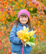 © Ermolaev Alexandr - Portrait of a happy young girl with down syndrome holding bouquet of autumn leaves