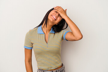 Young latin woman isolated on white background  laughs joyfully keeping hands on head. Happiness concept.