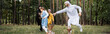 © LIGHTFIELD STUDIOS - Arabian parents playing with kids in park, banner