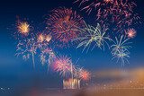 Fototapeta Panele - Colorful fireworks celebration and the twilight sky background.