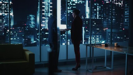 Aufkleber - Successful Corporate Top CEO's Talking, Using Laptop Computer while Standing in Big City Office at Night. Two Successful Managers Discuss Statistical Growth, Merger for e-Commerce Project