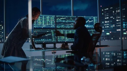 Poster - Financial Analyst Talking to Investment Banker in the Evening at Work. Chatting About Real-Time Stock Chart Data on Multi-Monitor Workstation. Businesspeople Have a Meeting in Broker Agency Office.