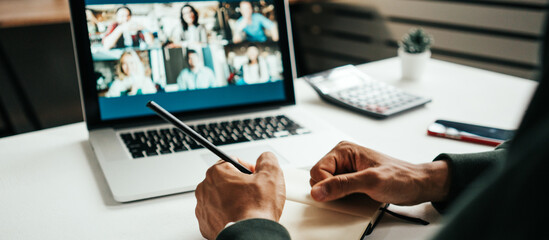 Wall Mural - Young black man has video conference call. Remote meeting using laptop. Hands close-up