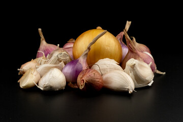 Wall Mural - Whole group pile ingredient of fresh onion garlic group isolated on black background