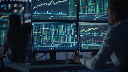 Poster - Financial Analysts and Day Traders Working on a Computers with Multi-Monitor Workstations with Real-Time Stocks, Commodities and Exchange Market Charts. Team of Brokers at Work in Agency. Rack Focus.