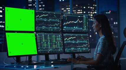 Poster - Financial Analyst Working on Computer with Multi-Monitor Workstation with Green Screen Chroma Key Mock Up Template and Real-Time Stock Charts. Businesswoman Works in Investment Bank in the Evening.