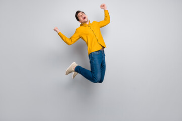 Sticker - Full length body size view of attractive cheery cool man jumping having fun attainment isolated over grey color background