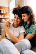 © (JLco) Julia Amaral - Young lesbian couple cuddling each other