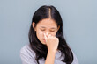 Eleven years old girl have symptoms of nasal congestion, try to squeeze her nose, have a stuffy nose