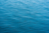 Fototapeta Łazienka - blurred blue water background with waves