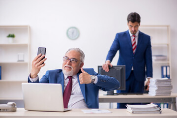 Two male colleagues working in the office