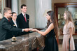 © davit85 - Picture of guests getting key card in hotel.