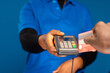 © Confidence - person swiping their credit card on a mobile point of sale device