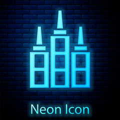 Sticker - Glowing neon Skyscraper icon isolated on brick wall background. Metropolis architecture panoramic landscape. Vector