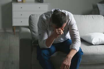 Wall Mural - Depressed mature man at home