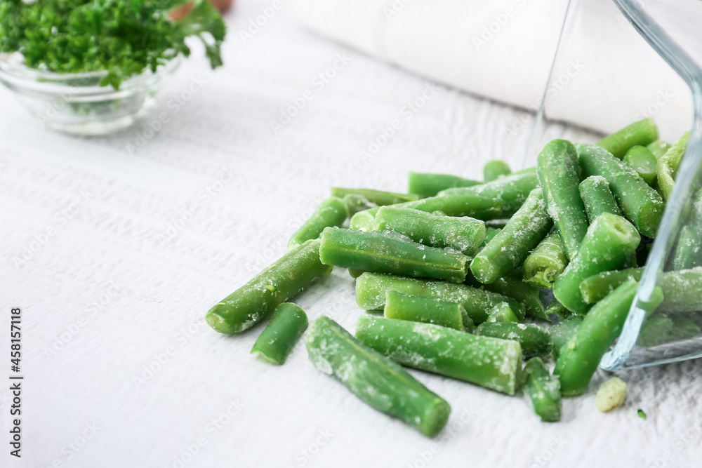 Frozen green beans on light background, closeup