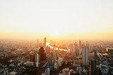 Fototapeta  - Landscape of the city of Bangkok painted by golden light during sunset