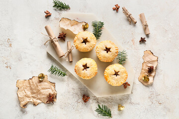 Wall Mural - Board with tasty mince pies on grunge background