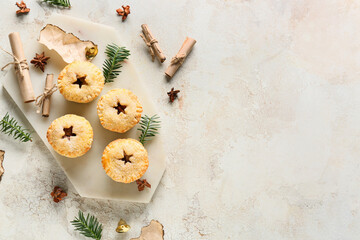 Wall Mural - Board with tasty mince pies on grunge background