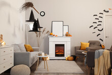 Interior Of Living Room With Fireplace And Halloween Decorations