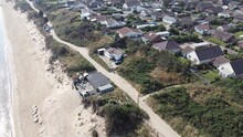Hemsby Seaside Village Norfolk England House In Danger From Coastal Erosion Aerial Footage 4K