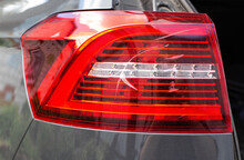 Rear Car Lamp With A Crack. Damage To The Stop Lamp, Accident. Close-up