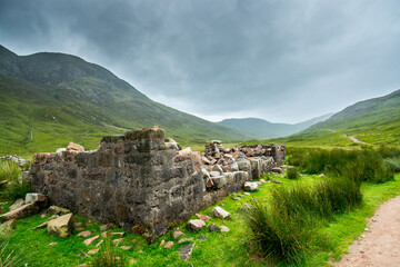 Wall Mural - Along the West Highland Way. A ruined farmhouse in the highland moor stands on the edge of the hiking path.